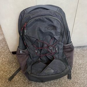 Grey North Face Backpack with Maroon Accents